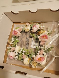 a box that has some flowers in it