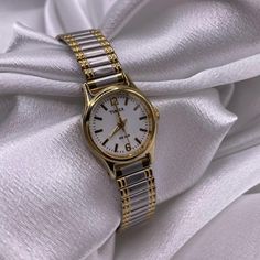 Gorgeous Two Tone Dainty Classy Stretch Band Watch by Timex  . . Installed new battery  Excellent working condition  .      Vintage, Gold, Silver, Two-tone, Coquette, Retro, Elegant, Princess, Unique, Iridescent, Diamonds, Crystals, Watch, Old money, Timex, Citizen, Geneva, Timeless, Modern, Timepiece, Quartz, Antique, Victorian, Deauville, Geneva, Bulova, link, Chain, Cuff, Bracelet, Art deco, Dainty, Mother of pearl face, cameo watch, Fairywatch, Mermaid, Gold Jewelry,  Disclaimer: Please keep in mind this is a second hand item we try our best to clean the item. Item will be sanitized before shipping out, found in very good condition minimal sign of wear on the back of the case and band. Two Tone Watches Women, Watch Old, Bracelet Art, Minimalist Watch, Stretch Band, Stretch Bands, Two Tone Watch, Women Wrist Watch, Antique Victorian