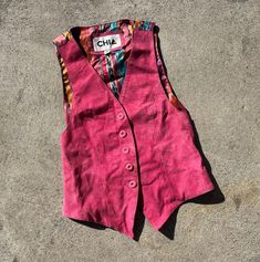 Vintage real leather vest Buttery soft hot pink suede fits estimated xs/s Estimated age 1980s Can be worn layered or as a sleeveless top Excellent vintage condition; normal light wear and distressing. Clean and odor free Approximate measurements 11" shoulder to shoulder 16.5" pit to pit 21.5" length All items are sold as is with no returns and no partial refunds. I describe and measure items carefully but may miss a slight flaw and all measurements should be considered approximate. Please zoom i Pink Fitted Sleeveless Vest, Fitted Pink Tank Top For Fall, 90s Style Spring Vest, Casual Fitted Vest For Festivals, Pink Fitted 90s Style Tank Top, Fitted Pink Vest For Fall, Fitted Bohemian Vest For Spring, Vintage Pink Tank Top For Spring, Fitted Tank Top For Fall Festivals