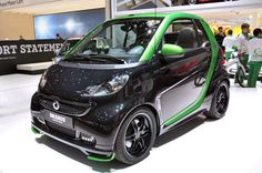 a smart car is on display at an auto show