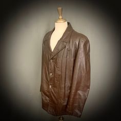 *ITEM DETAILS* - Era- 1970's - Brand- London Fog - Size- 46 Regular (please see the measurements for an accurate fit) - Material- Leather Acetate Lining Cotton/Poly Removable Lining - Made in Baltimore, Md *This item is in excellent vintage condition with no holes or stains.* *Shown here on a size 6-8 mannequin* *Measurements are taken while flat and doubled for the chest/waist* - Shoulders- 20.5 inches (across, seam to seam) - Chest- 46 inches (pit to pit, doubled) - Length- 29 inches from shou Vintage Brown Outerwear For Work, Retro Long Sleeve Leather Jacket For Work, Vintage Leather Jacket With Lapel Collar For Winter, Retro Business Outerwear For Fall, Vintage Brown Single Breasted Outerwear, Fitted Retro Vintage Brown Outerwear, Vintage Fitted Brown Outerwear, Vintage Single-breasted Outerwear In Vintage Brown, Retro Vintage Brown Outerwear For Work