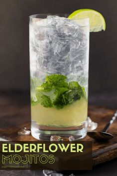 the elderflower mojito is served in a tall glass with ice and lime