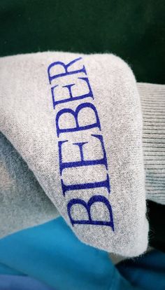 a pair of blue and white socks with the word blbrbr on them