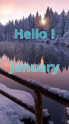 the words hello january are written in front of a lake and snow covered forest with trees