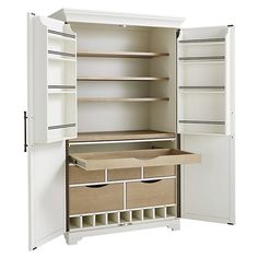 an open white cabinet with drawers and shelves