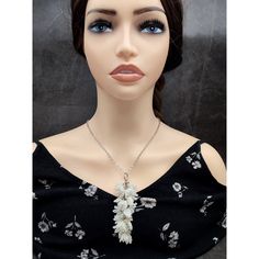 Explore the delicate allure of nature with our Beaded Lily of the Valley Cluster Necklace. Crafted from shimmering white beads, each intricately woven blossom evokes the charm of the beloved flower. Adorned with pristine glass leaves and translucent bicone accents, this necklace exudes timeless elegance. Perfect for adding a touch of ethereal beauty to any ensemble, it's a graceful ode to floral enchantment Height of beaded pendant : 3 3/4 inches ( 9.5 cm ) Length of chain : 22 inches ( 56 cm ) White Pearl Pendant Jewelry, White Crystal Necklace For Gift, Adjustable White Jewelry With Flower Decoration, White Crystal Flower-shaped Jewelry, White Crystal Flower Jewelry, Handmade White Crystal Dangle Necklace, Elegant White Crystal Necklaces With Pearl Drop, Handmade White Crystal Wedding Necklaces, Delicate White Pearl Beaded Necklaces