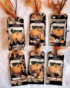 four tags with pictures of pumpkins on them