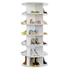 a white shelf filled with lots of shoes