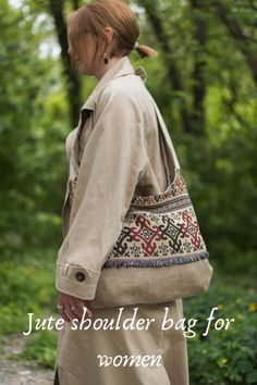 a woman carrying a handbag in the woods