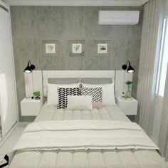 a white bed sitting in a bedroom next to two lamps on either side of it