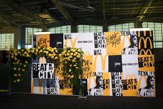 flowers are placed in front of a mcdonald's booth sign that reads, new york city