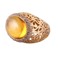 Pomellato 18k rose gold Arabesque ring with 1.40ctw Fancy VS diamonds and 23mm x 16mm citrine. DESIGNER: Pomellato MATERIAL: 18k Gold GEMSTONES: Diamond, Citrine DIMENSIONS: Ring size 6.25, top is 22mm x 30mm. MARKED/TESTED: Pomellato, 750, Italian mark. WEIGHT: 23.1 grams CONDITION: Previously Owned/Excellent Condition Dome Ring, Vs Diamond, Domed Ring, Arabesque, 18k Rose Gold, Citrine, Gold Rings, 18k Gold, Ring Size