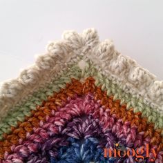 a crocheted square is shown with the words moogly written in it