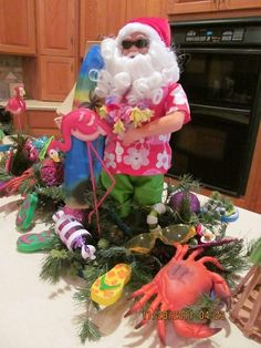 there is a christmas decoration on the kitchen counter with santa claus and other holiday decorations