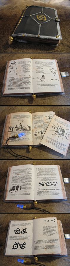 four open books sitting on top of a wooden table next to each other with writing on them