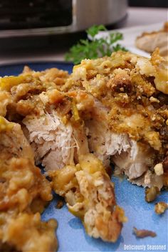 A crock pot in the background with a blue plate with a serving of chicken and stuffing on it. Slow Cooker Chicken Stuffing, Slow Cooker Chicken And Stuffing, Crockpot Pork Ribs, Crock Pot Chuck Roast, Chicken And Stuffing, Chuck Roast Recipes, Chicken Stuffing, Stuffing Ingredients, Bbq Dishes