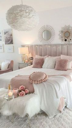 a bedroom with pink and white decor on the walls, carpeted flooring and bedding