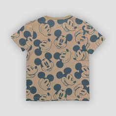 This Mickey Mouse Short-Sleeve Graphic T-Shirt adds the iconic, lovable cartoon to your child's wardrobe. An allover print of cheerful Mickey faces in black stands out from the tan-color background with a magical touch of whimsy, along with a red-lettered "Mickey" text on the chest for a fan-favorite look. Made of midweight jersey fabric, this tagless T-shirt tailored in a standard fit that hits at the hip will help them stay comfortable during any activity. Mickey Mouse Graphic Tee Tops, Playful Cotton Mickey Mouse T-shirt, Playful Cotton T-shirt With All Over Print, Summer Mickey Mouse Short Sleeve T-shirt, Brown Cotton Tops With Cartoon Print, Summer Mickey Mouse T-shirt With Short Sleeves, Mickey Mouse Cotton T-shirt For Summer, Brown Cotton Top With Cartoon Print, Summer Cotton Mickey Mouse T-shirt