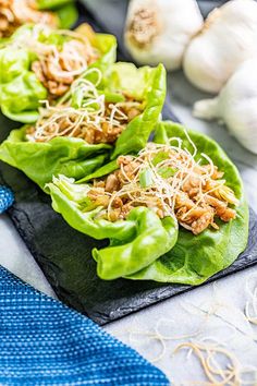 three lettuce cups filled with meat and vegetables