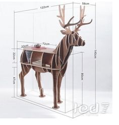 a wooden sculpture of a deer with its head on a desk and the measurements for it