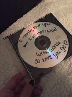 someone is holding up a cd that has been written on it with the words i really love you, but in not good