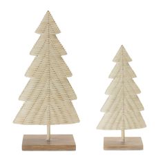 two small wooden christmas trees sitting on top of each other