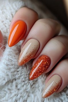 Get ready for fall with this gorgeous autumn-inspired nail design! Featuring a mix of solid orange, neutral beige, and glitter ombré accents, this manicure combines warm tones with a touch of sparkle, making it the perfect choice for seasonal vibes. Great for both casual wear and special occasions. Simple Fall Nails With Glitter, Fall Season Nails Orange, November Nail Designs Fall, Fall Almond Nails Ideas Orange, Almond Nails October 2024, Thanksgiving Gel Nails Designs, Classy Oval Nails Fall, Burnt Orange Ombre Nails Fall, Orange Glitter Nails Fall