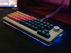 a computer keyboard sitting on top of a table