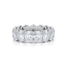 a white gold ring with five round diamonds