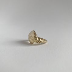 This shape is cast from a rock I found on the beaches of the Pacific Coast. The roundness and irregular shape envelop all the beauty that nature provides. Depending on casting, each rock will look completely unique with its own markings and character. Along the side of the ring, are hand-formed serpents. COMPOSITION 18K Recycled Gold 4 or 6 Ring Size Alternate sizes available upon request Antique 14k Gold Hand Forged Rings, Engraved Brass Open Ring Jewelry, Heirloom Style Hand Forged Brass Rings, Heirloom Hand Forged Brass Rings, Hand Forged Yellow Gold Open Ring Jewelry, Recycled Gold Gemstone Ring, Unique Untreated Yellow Gold Jewelry, Hand-forged Yellow Gold Open Ring Jewelry, Hand Cast Brass Ring