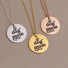 "Dog Mom Gift Tag Necklace Gold, Custom Engraved Pet Charm Pendant Necklace for Fur Mom for Christmas, Funny Unique Gift for Pet Mom 🌿 A beautiful laser engraved mirror finish round disc charm hanging from a real high quality 14k gold filled or 925 sterling silver chain. We offer a large collection of engraved disc charm necklaces so be sure to checkout all our options for Mother, Graduates, Nurses, Teachers and much more!  CLICK HERE FOR MORE OPTIONS: http://www.etsy.com/shop/delezhen?ref=condensed_trust_header_title_sold&section_id=37635303 Every piece arrives packaged on a custom card inside of an elegant box, complete with a polishing cloth & care instructions. These necklaces are meant to be gifted! H O W ∙ T O ∙ O R D E R 1st DROP DOWN menu * Select the METAL FINISH you would like. Christmas Gift Stainless Steel Jewelry, Laser Jewelry, Fur Mom, Pet Mom, Personalized Gift Wrap, Necklace Rose Gold, Christmas Funny, Rose Gold Chain, Charm Necklaces