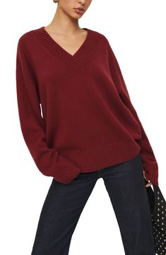 A blend of recycled cashmere and virgin cashmere adds a luxuriously soft feel to this oversized, layerable V-neck sweater trimmed with cozy ribbing. 24 1/2" length V-neck Long sleeves Ribbed cuffs and hem 95% recycled cashmere, 5% cashmere Dry clean Imported Burgundy V Neck Sweater Outfit, V Neck Sweater Outfit, Neck Sweater Outfit, Fall Winter Fashion Trends, Recycled Cashmere, Cashmere Jumper, Style Winter, Burgundy Sweater, Oversized Silhouette