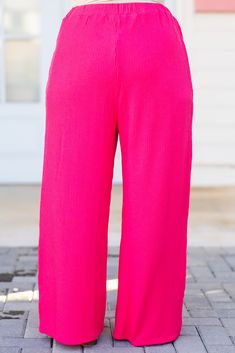 You know you need these beauties in your life! These pants in hot pink offer a flowy fit for both casual outings and comfortable lounging! The bold color adds versatility to any wardrobe! Expertly crafted and perfect for all-day wear! 67% Polyester, 25% Rayon, 8% Spandex Stretch Pink Bottoms Solid Color, Pink Elastic Waistband Pants For Loungewear, Trendy Solid Color Wide Leg Loungewear Pants, Trendy Solid Color Wide Leg Pants For Loungewear, Trendy Solid Color Wide Leg Lounge Pants, Stretch Pink Pants, Trendy Pink Ribbed Bottoms, Pink Stretch Pants Solid Color, Stretch Pink Solid Color Pants