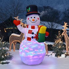 an inflatable snowman with christmas decorations and lights