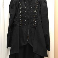 Steam Punk/Gothic Women's Black Jacket Size X-Large Gorgeous Steam Punk Black Jacket Worn Once. Front Zipper W/Zipper Sleeves, Hardware Front Flattering Fit W/Double Adjustable Snap Side Straps. Short In Front, Long In Back, Silk Lining *Smoke Free Environment *Reasonable Offer Accepted *Bundle With Other Items In My Closet Save & Get Multiple Items Shipped For The Price Of One! Hello! Please Start A Bundle If You Are Interested In Purchasing So I May Make You An Offer. Cheers! Black Punk Style Outerwear With Button Closure, Black Punk Outerwear With Rivets, Black Gothic Outerwear With Spikes, Black Punk Biker Jacket With Rivets, Black Gothic Outerwear With Zipper Closure, Offer Accepted, Steam Punk, Black Jacket, Front Zipper