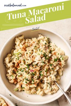 a white bowl filled with tuna macaroni salad