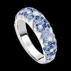 a white gold ring with blue and white diamonds