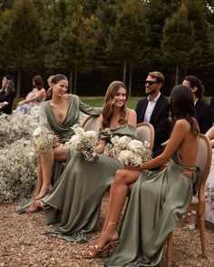 the bridesmaids are all dressed in green dresses