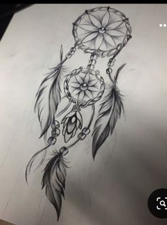 a drawing of a dream catcher with flowers on it