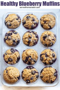 blueberry muffins on a baking tray ready to be baked