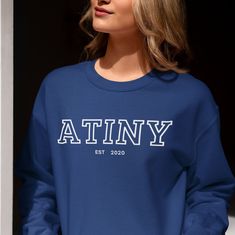 Ateez Atiny Sweatshirt, Kpop Atiny Custom Merch, Personalized Kpop Crewneck Sweatshirt, Gift for Atiny Ateez, Kpop Sweater, Ateez Merch, Atiny Custom Year ♡ Our Product ♡ Made from premium, soft fabric, it's perfect for everyday wear or showing your love for BTS at concerts and gatherings!! ♡ 50% Cotton 50% Polyester ♡ Ultra Soft, Super Comfy, Durable and Stylish. Eco friendly. ♡ Sizing Questions? ♡ Please refer to the Size Chart in the Listing Photos to find your correct size. ♡ Measurements ar Fitted Crew Neck Sweater With Letter Print, Casual Fitted Letter Print Sweatshirt, Blue Tops With Name Print For College, Blue Crew Neck Sweatshirt With Name Print, Casual Crew Neck Sweater With Name Print, Blue Long Sleeve Top With Name Print, Fitted Long Sleeve Top With Name Print, Casual Blue Sweatshirt With Name Print, Blue Long Sleeve T-shirt With Name Print