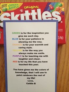 a card with the words skittles written on it next to a candy bar wrapper