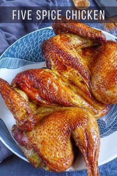 three pieces of chicken on a blue and white plate with the words five spice chicken