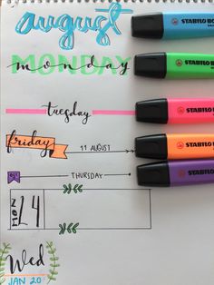 three markers are sitting on top of a paper with the date and month in it