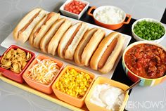 a table topped with lots of food and bowls filled with dips on top of it