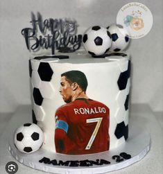 a birthday cake with a soccer ball and ronaldo on it's top tier