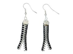 black and white beaded earrings with beads on the ends, hanging from silver hooks