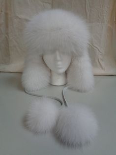 VERY STYLISH WHITE FOX FUR HAT WITH WHITE LEATHER TOP AND EAR FLAPS FOR WOMEN. COMPLETED WITH POMPOM. THIS ITEM IS BRAND NEW, MADE TO MEASUREMENT! MEASUREMENTS: SIZE: THIS ITEM WILL BE MADE TO MEASUREMENT, AFTER PURCHASE PLEASE CONFIRM YOUR HEAD CIRCUMFERENCE INCLUDING THE TIP OF YOUR EARS AND WE WILL PROCEED THANK YOU ap31 Oliverfurs 9250 Parc Ave. #204, Montreal, Quebec, H2N 1Z2, Canada www.oliverfurswholesale.com oliver@oliverfurswholesale.com Toll free: 1-866-845-9997 International: 1-514-84 White Fur Hat, Fox White, Pretty Dark Skin, Winter Fur Hat, Fur Mitten, Rabbit Fur Hat, Fur Top, Fox Hat, Fur Hats