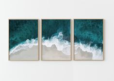 three framed pictures hanging on the wall next to each other with ocean waves in them