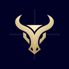 the bull's head with horns is shown in gold on a black background,